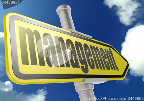 Image of Yellow road sign with management word under blue sky