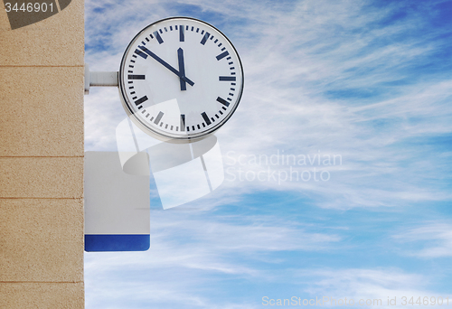 Image of Clock and plate for information at train station