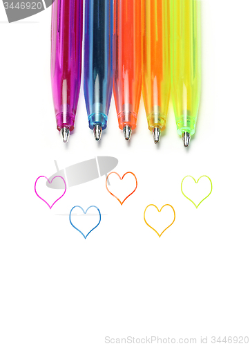 Image of Bright colorful pens and abstract hearts