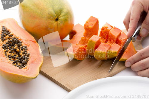 Image of Cutting A Papaya Quarter Into Six Slices