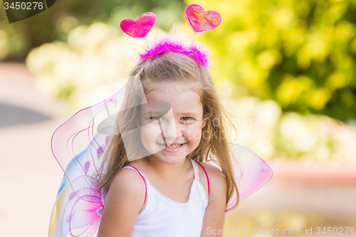Image of Happy four-year girl playing in fairy