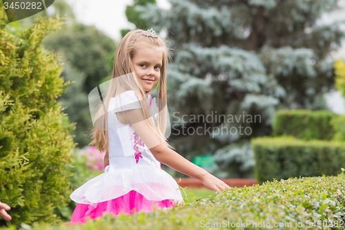 Image of Princess Girl walks in the garden