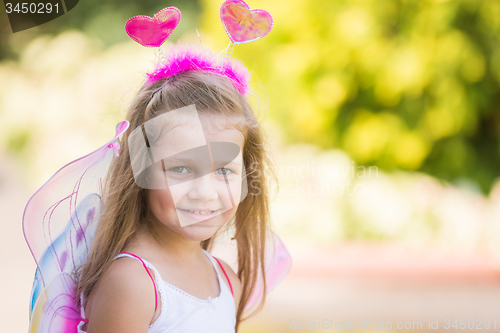 Image of Happy four-year girl in suit butterfly