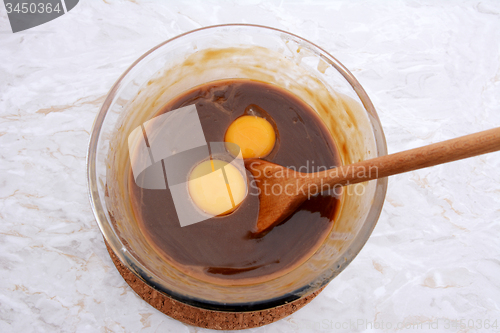 Image of Stirring egg yolks into pecan pie filling