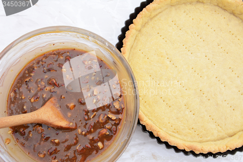 Image of Making pecan pie - nutty pie filling and pie crust
