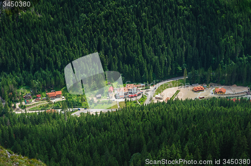 Image of Single house on a meadow in mountains