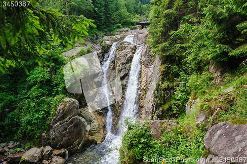 Image of waterfall in deep forest at mountains