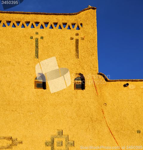 Image of old brown construction in africa morocco and sky  near the tower