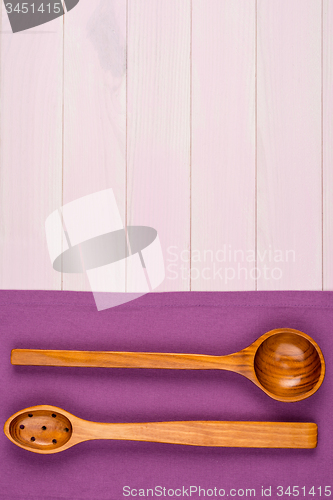 Image of Kitchenware on purple towel