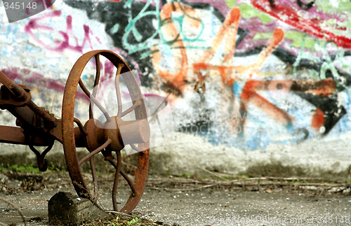 Image of graffiti with rusty tool