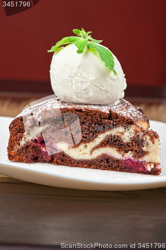 Image of chocolate cake with jam ice cream