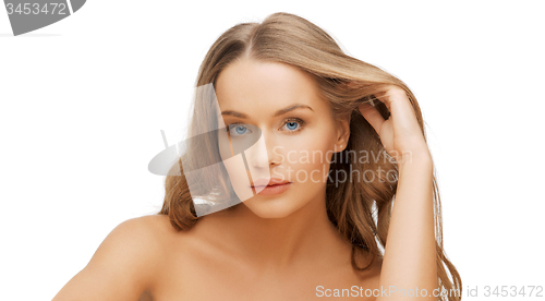 Image of beautiful woman face with long blond hair