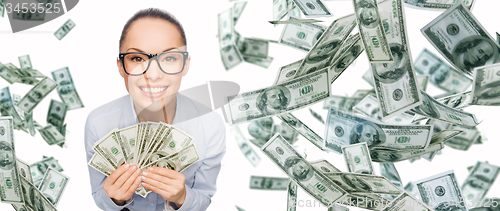 Image of smiling businesswoman with dollar cash money