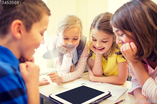 Image of group of school kids with tablet pc in classroom