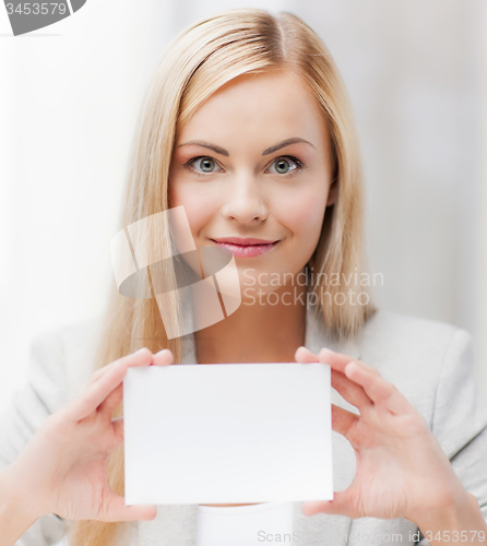 Image of woman with blank business or name card