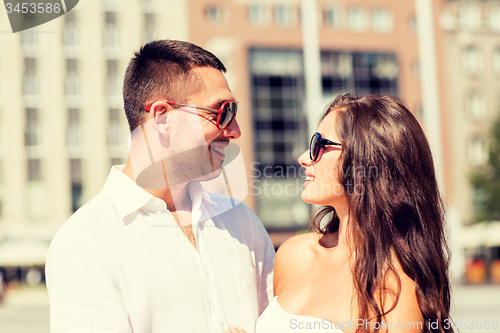 Image of smiling couple in city