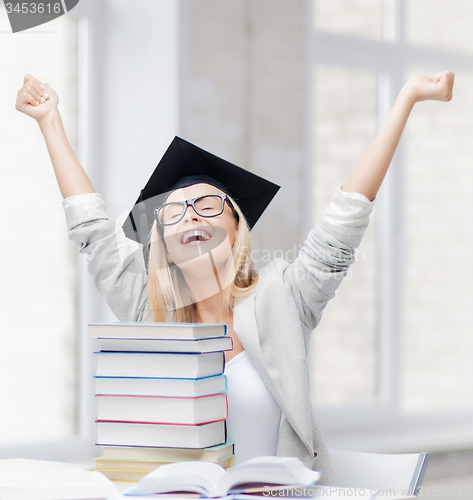 Image of happy student in graduation cap