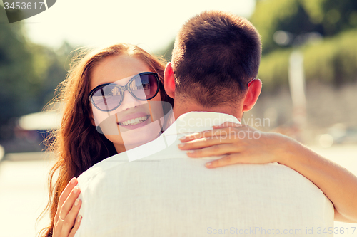 Image of smiling couple in city