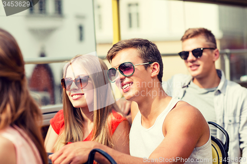 Image of smiling couple traveling by tour bus
