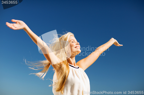 Image of beautiful woman enjoying summer outdoors