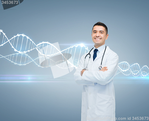 Image of smiling male doctor in white coat and dna molecule