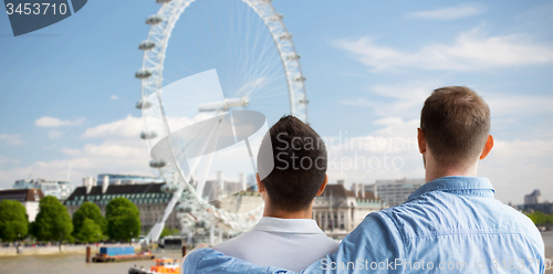 Image of close up of male gay couple looking at london view