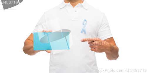Image of man with prostate cancer awareness ribbon and card