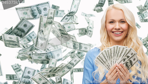 Image of smiling businesswoman with dollar cash money