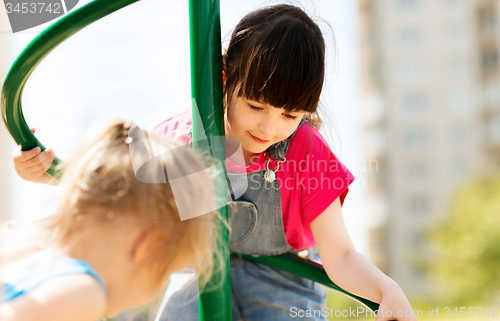 Image of group of happy little girls on children playground