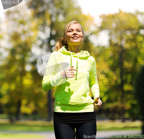 Image of woman jogging outdoors