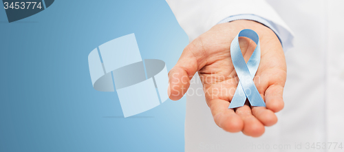 Image of doctor hand with prostate cancer awareness ribbon