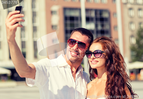Image of smiling couple in city