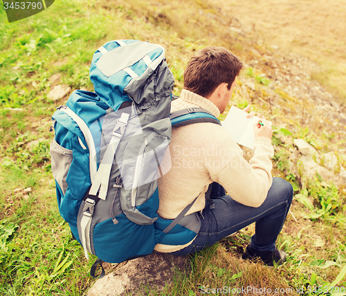 Image of man with backpack hiking