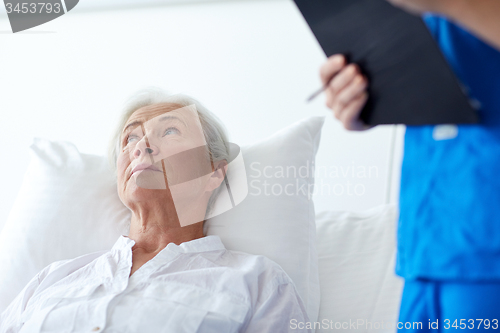 Image of nurse and senior woman patient at hospital