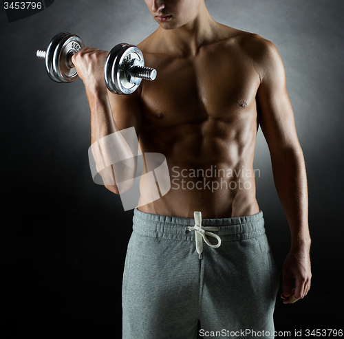 Image of young man with dumbbell