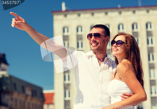 Image of smiling couple in city