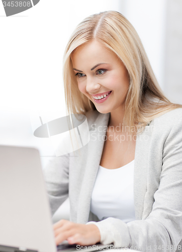 Image of businesswoman with laptop