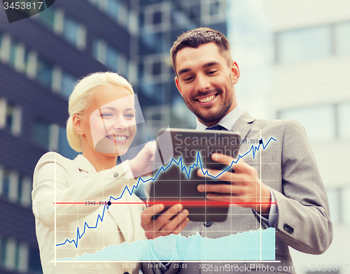 Image of smiling businessmen with tablet pc outdoors