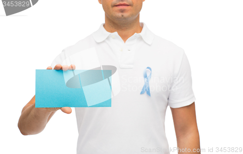 Image of man with prostate cancer awareness ribbon and card