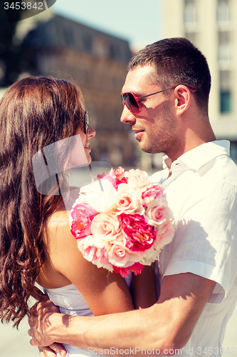 Image of smiling couple in city