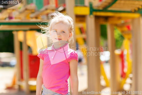 Image of happy little girl on children playground