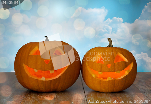 Image of close up of carved halloween pumpkins on table