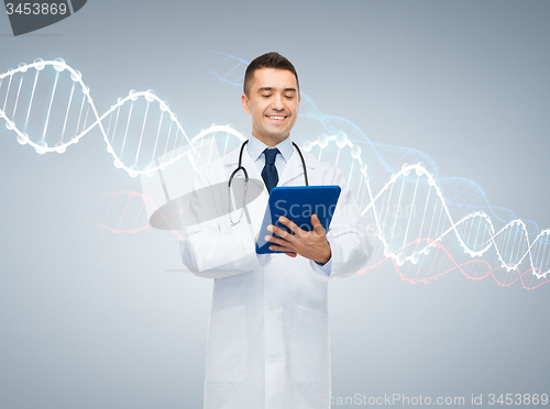 Image of happy male doctor with tablet pc and dna molecule