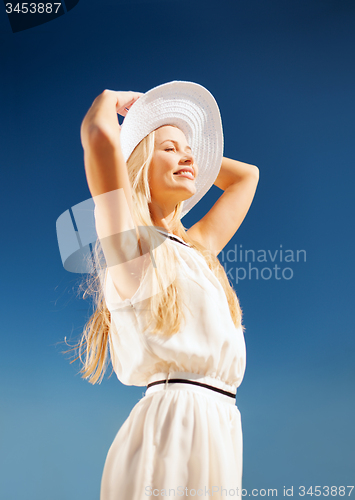 Image of beautiful woman enjoying summer outdoors