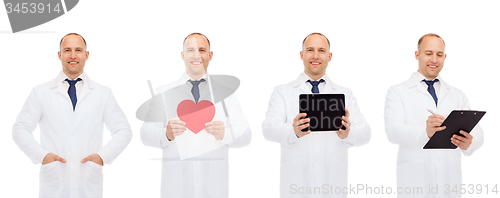 Image of doctors with red heart, tablet pc and clipboard