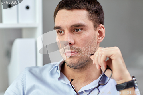 Image of portrait of businessman with eyeglasses at office