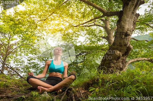 Image of Woman relaxing in beautiful nature.