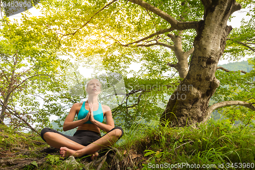 Image of Woman relaxing in beautiful nature.