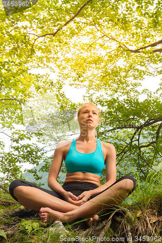 Image of Woman relaxing in beautiful nature.