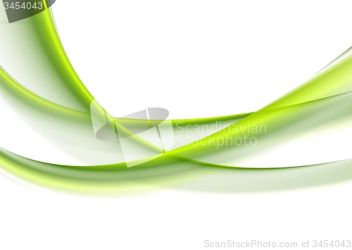Image of Green smooth blurred waves on white background